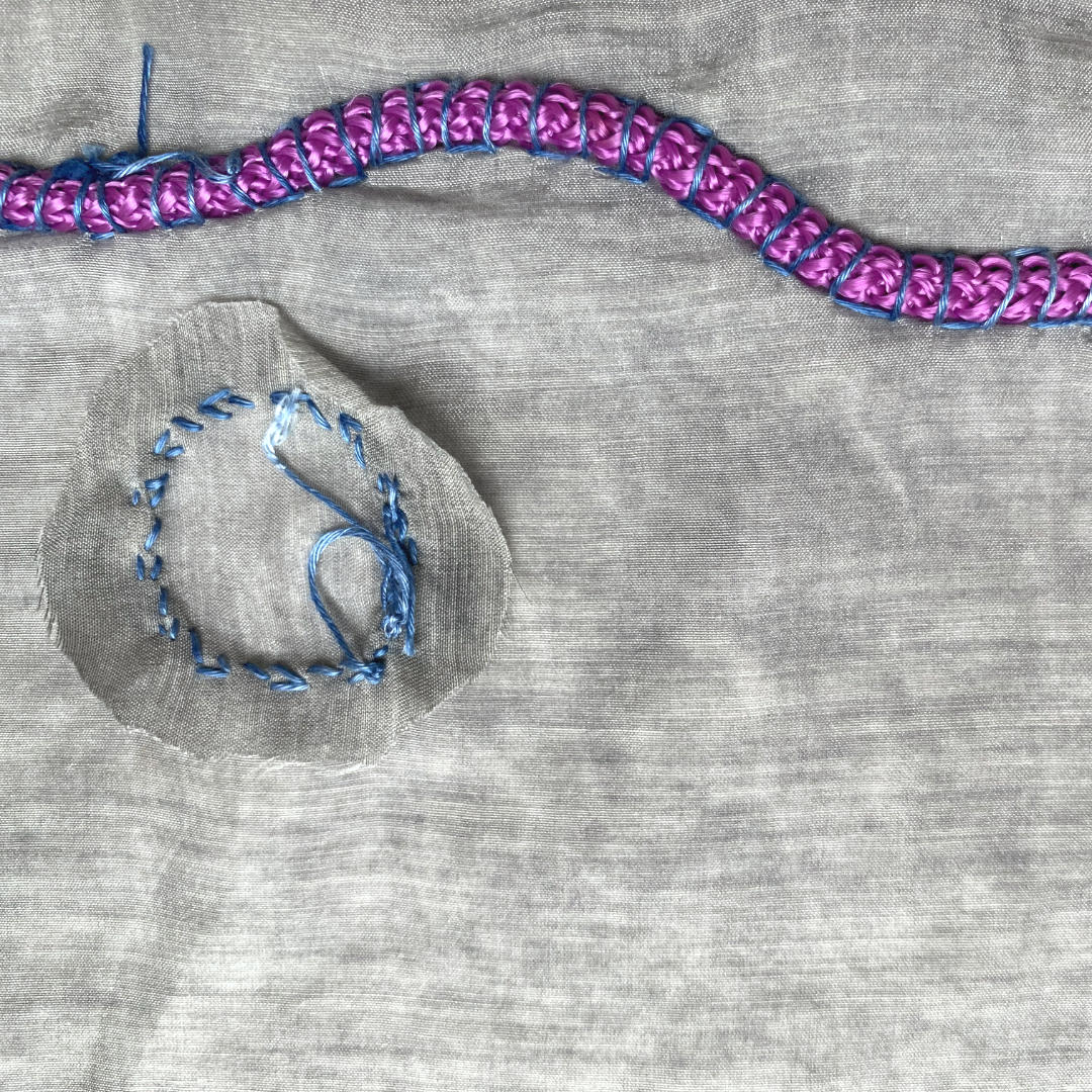 grey scrunchie with filled cording detail