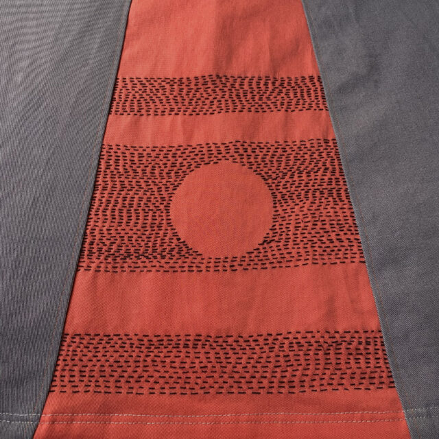 running stitches on orange insert