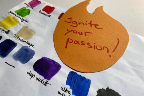 The words Ignite your passion! written in a flame on a colour chart