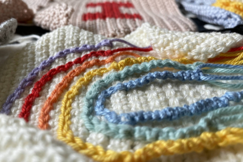 granny square with a rainbow on white background