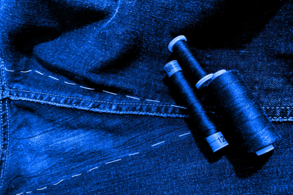 damaged crotch area of jeans with fitting yarns