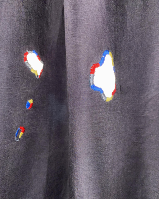 patches with reflector fabric on dark grey jumpsuit