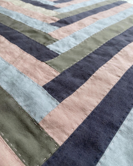 patchwork cover in rose lightblue darkblue and olive with handstitching