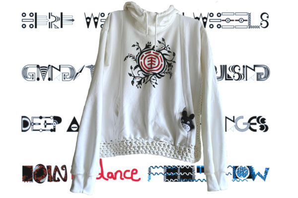 white hoodie with abstract earth print and crocheted hemline