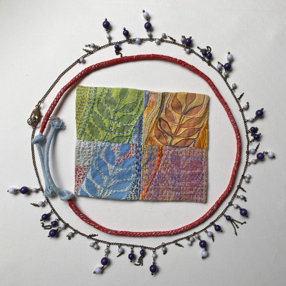 embroidered cloth for phone case + cord + necklace