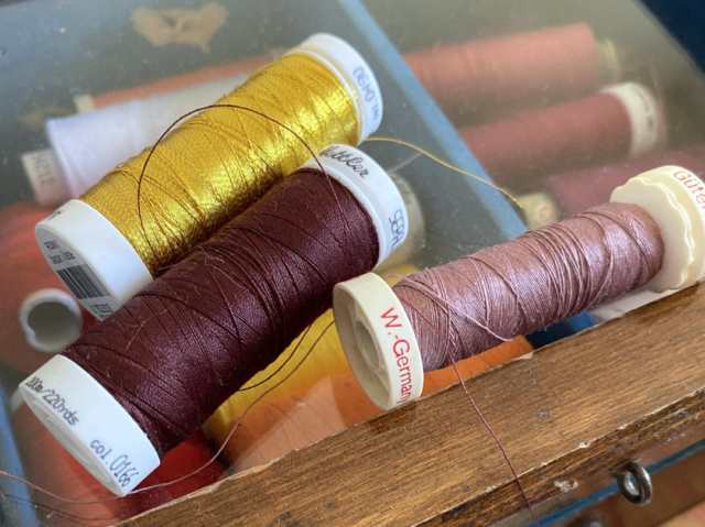 gold, rust brown and pastel brown sewing thread