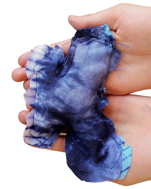 selfmade blue fabric butterfly holden in hands