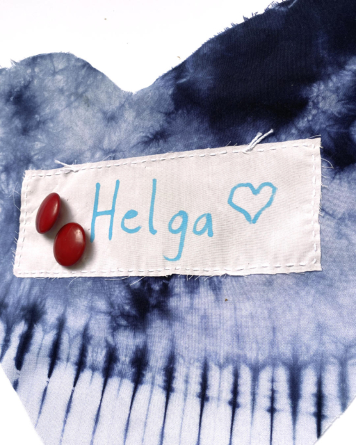 batik heart with stitched white patch "Helga" and two red buttons