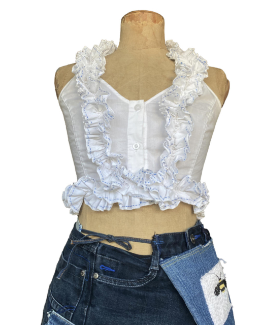 white crop top with embroidered crossed ruffles