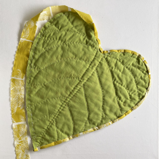 green quilted heart with yellow border